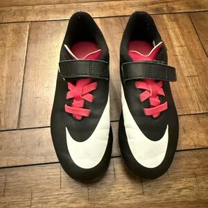 Girls Nike soccer cleats Black and White with pink. Size 13c